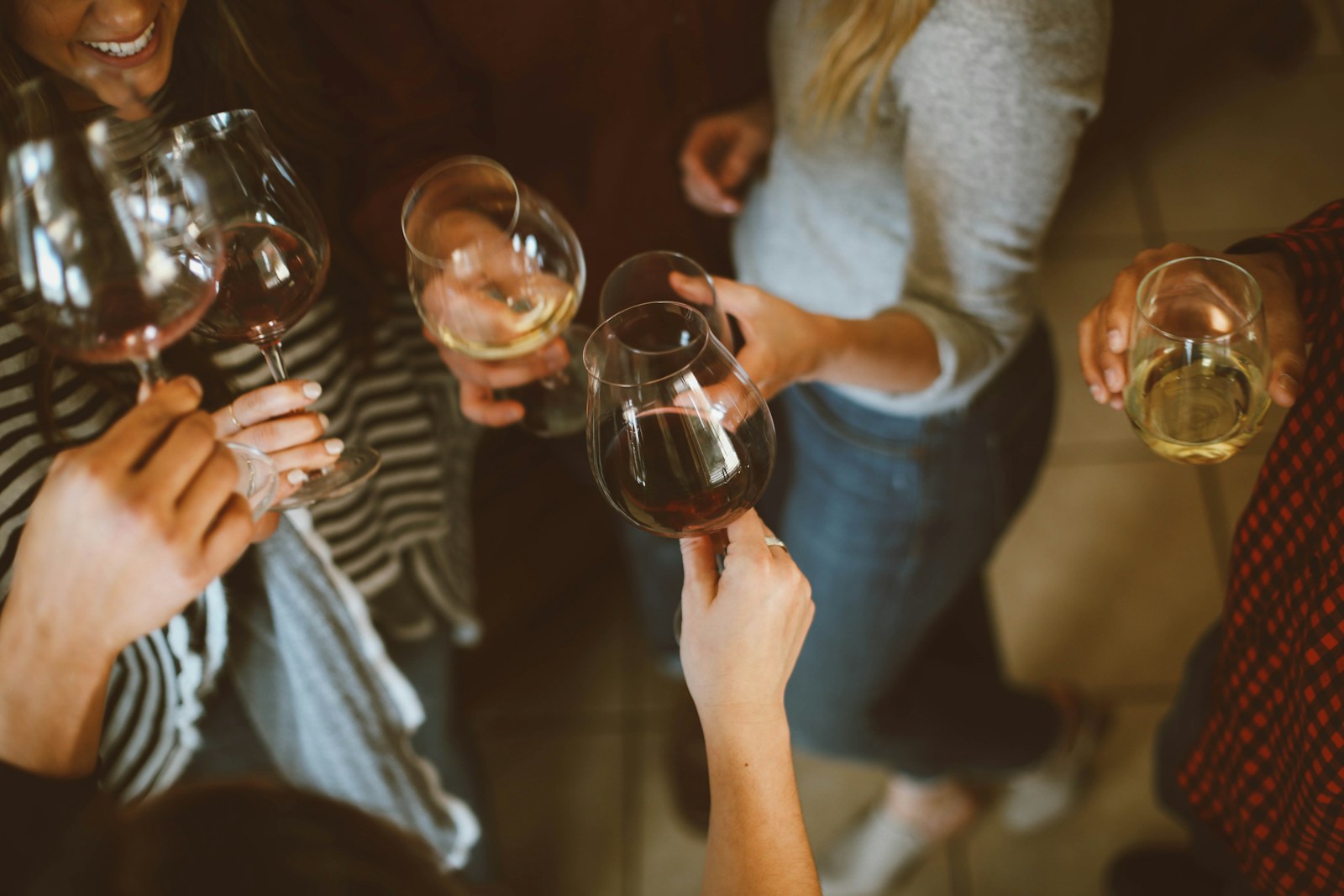 Friends raising glasses in a toast — the celebration all the planning is working toward